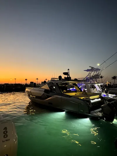 Second Chances Yacht Photos Pics 2022 Azimut Verve 47 yacht illuminated at sunset in a marina.