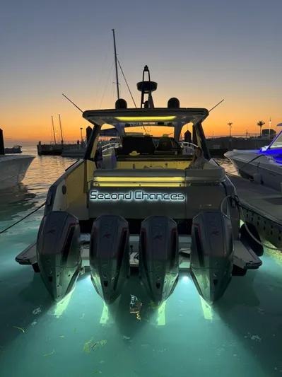 Second Chances Yacht Photos Pics 2022 Azimut Verve 47 yacht at sunset, illuminated with underwater lights.