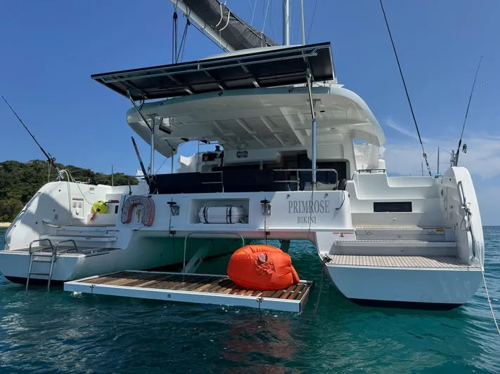 Primrose Yacht Photos Pics 2023 Lagoon 46 catamaran on water, featuring spacious deck and modern design.