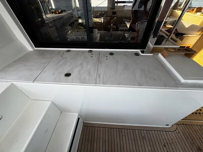 Primrose Yacht Photos Pics 2023 Lagoon 46 yacht interior with sleek countertops and modern design.