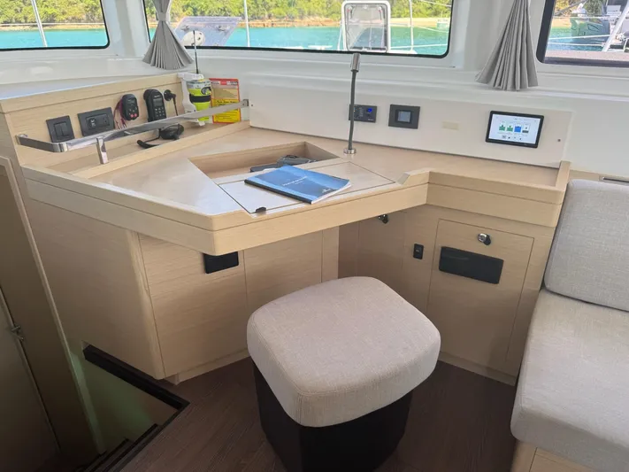 Primrose Yacht Photos Pics 2023 Lagoon 46 yacht interior with navigation station and modern amenities.