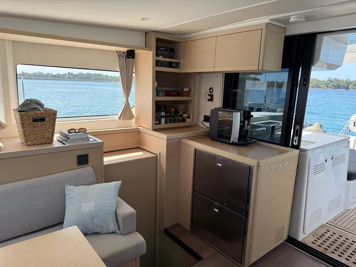 Primrose Yacht Photos Pics Interior of 2023 Lagoon 46 yacht with modern kitchen and ocean view.