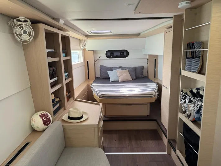 Primrose Yacht Photos Pics Luxurious interior of 2023 Lagoon 46 yacht with cozy bedroom and modern furnishings.