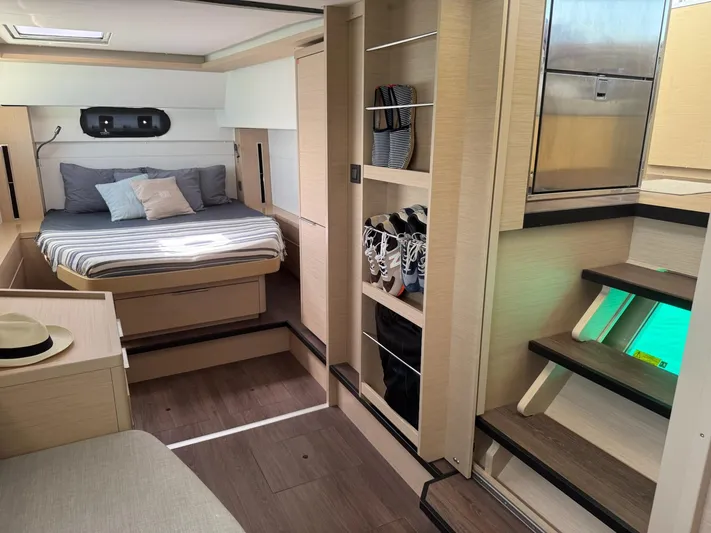 Primrose Yacht Photos Pics 2023 Lagoon 46 yacht interior with cozy bedroom, modern design, and ample storage space.