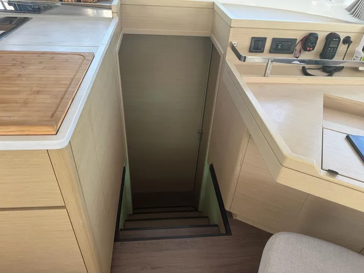 Primrose Yacht Photos Pics Interior of 2023 Lagoon 46 yacht showing stairs and modern kitchen area.