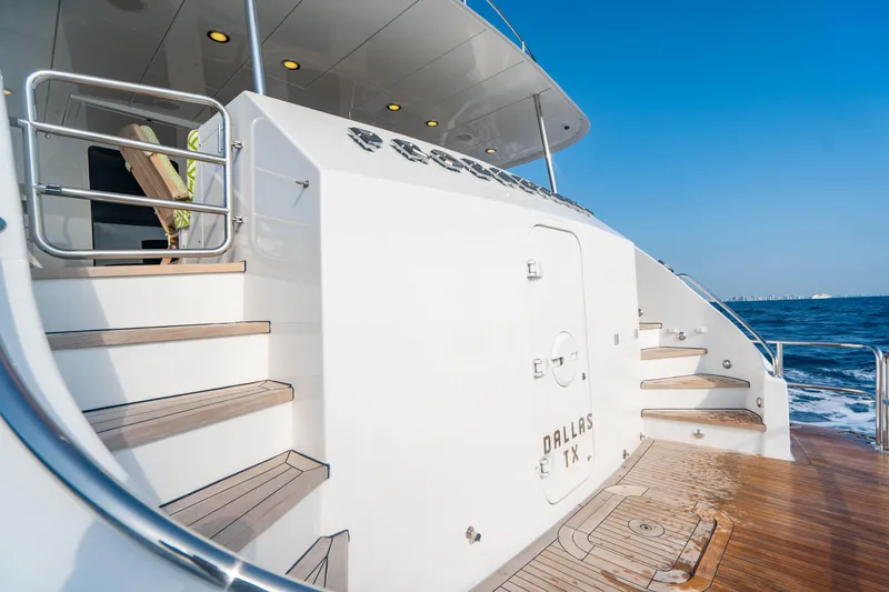 Magic Yacht Photos Pics Hatteras 100 Motor Yacht 2005, elegant deck view, ocean backdrop.