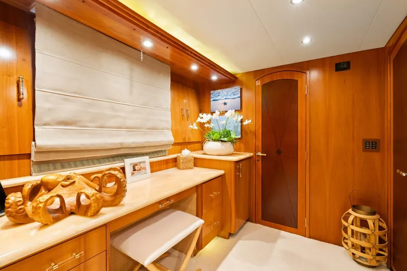 Magic Yacht Photos Pics Luxurious wooden interior of 2005 Hatteras 100 Motor Yacht cabin with elegant decor.
