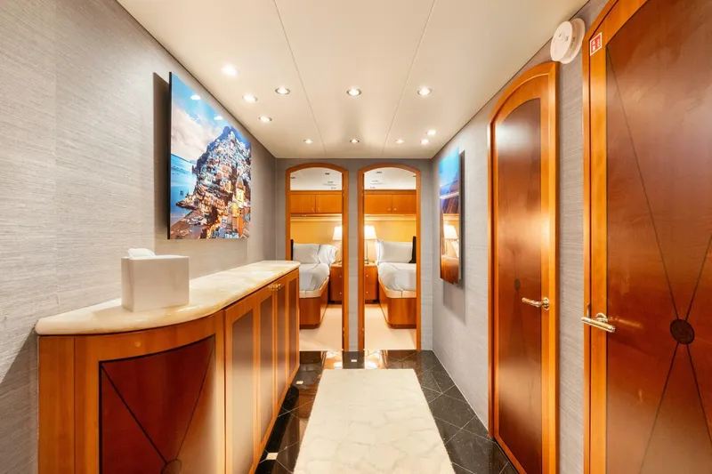 Magic Yacht Photos Pics Luxurious interior hallway of a 2005 Hatteras 100 Motor Yacht with elegant wood finishes.
