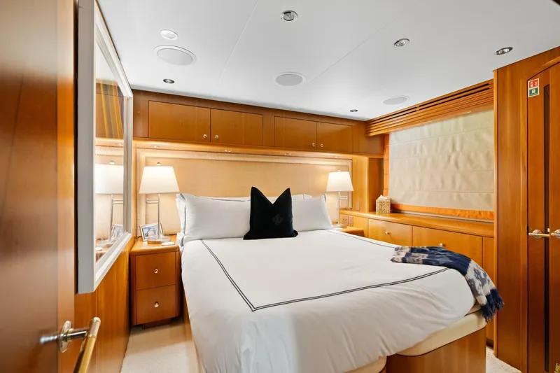 Magic Yacht Photos Pics Luxurious bedroom in 2005 Hatteras 100 Motor Yacht with elegant wood finishes.