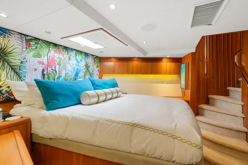 Magic Yacht Photos Pics Luxurious bedroom in 2005 Hatteras 100 Motor Yacht with vibrant floral decor.