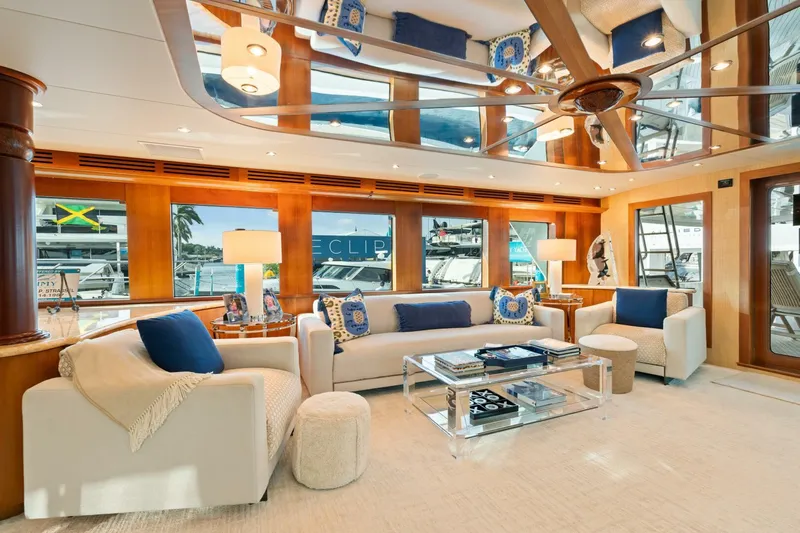 Magic Yacht Photos Pics Luxurious interior of 2005 Hatteras 100 Motor Yacht with elegant seating and decor.