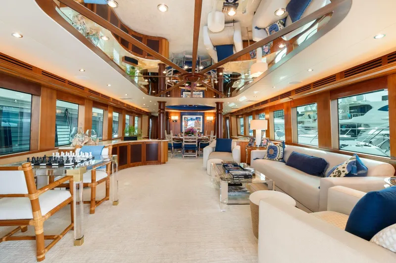 Magic Yacht Photos Pics Luxurious interior of a 2005 Hatteras 100 Motor Yacht with elegant furnishings and large windows.
