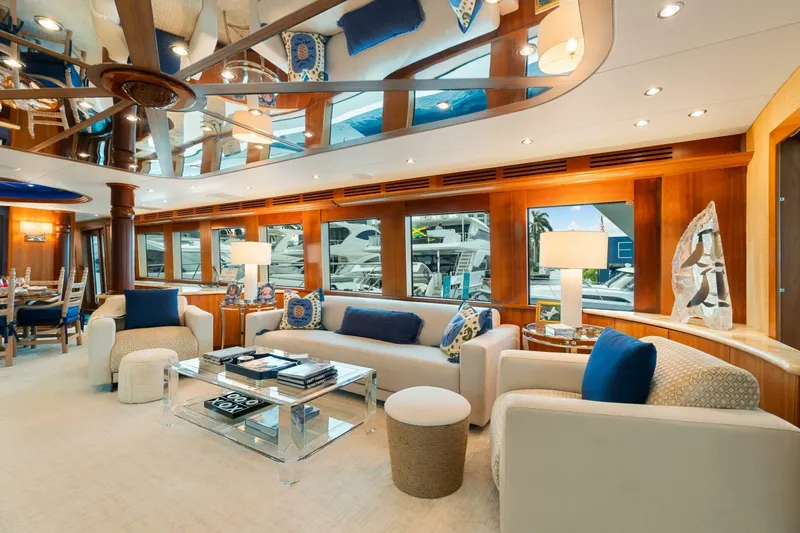 Magic Yacht Photos Pics Luxurious interior of 2005 Hatteras 100 Motor Yacht with elegant seating and decor.