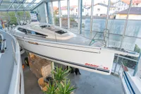 2023 Dehler 34 sailboat displayed indoors, showcasing sleek design and modern features.