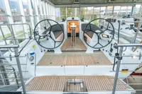 2023 Dehler 34 yacht interior with dual steering wheels and teak flooring.