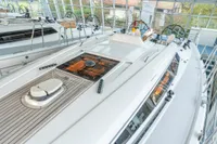 2023 Dehler 34 yacht interior with sleek design and modern features in a showroom setting.