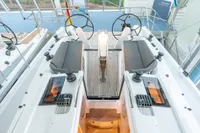 2023 Dehler 34 yacht cockpit with dual steering wheels and sleek seating.