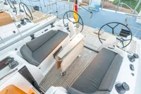 2023 Dehler 34 yacht cockpit with dual steering wheels and cushioned seating.