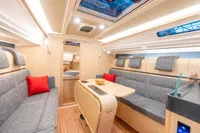 Modern interior of 2023 Dehler 34 yacht with sleek design and comfortable seating.