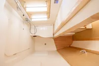 Interior of 2023 Dehler 34 yacht bathroom with modern fixtures and wooden accents.
