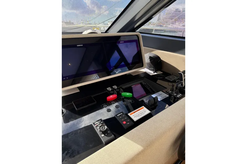  Yacht Photos Pics 2023 Ferretti Yachts 580 helm with advanced navigation controls and displays.