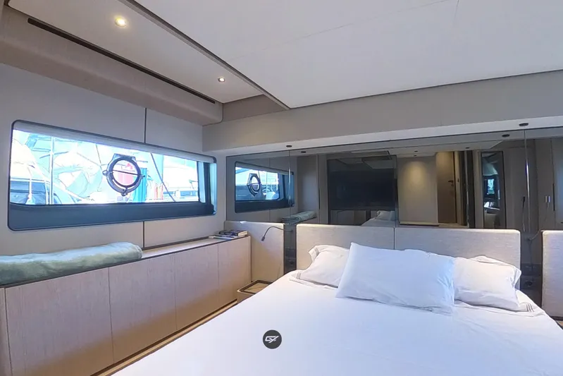  Yacht Photos Pics Luxurious bedroom interior of 2023 Ferretti Yachts 580 with modern design and large windows.