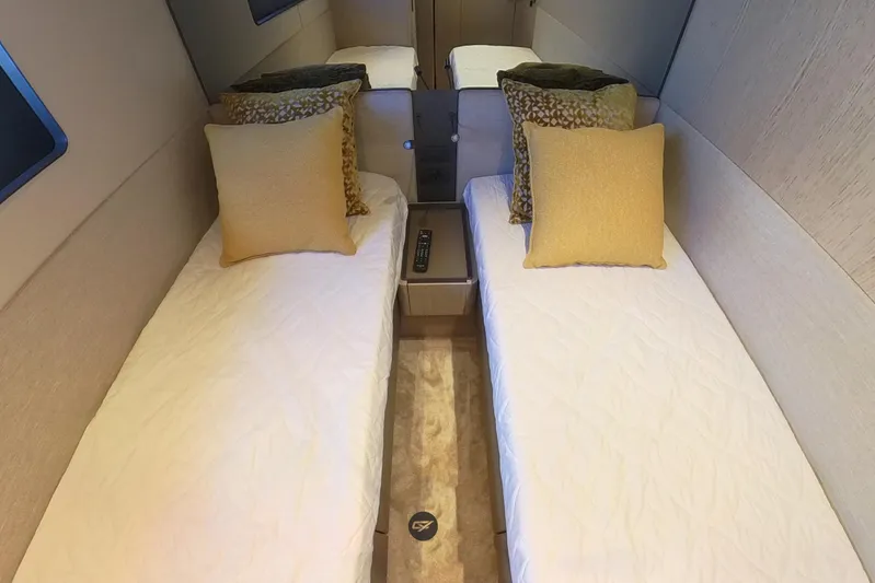  Yacht Photos Pics Luxurious twin cabin interior of 2023 Ferretti Yachts 580 with elegant bedding.