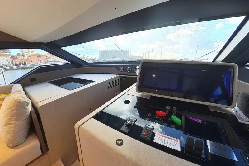  Yacht Photos Pics Interior view of 2023 Ferretti Yachts 580 helm with modern navigation controls.