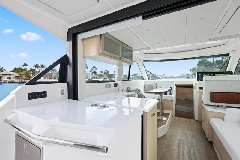  Yacht Photos Pics 2024 Regal 38 XO yacht interior with modern design and spacious seating area.