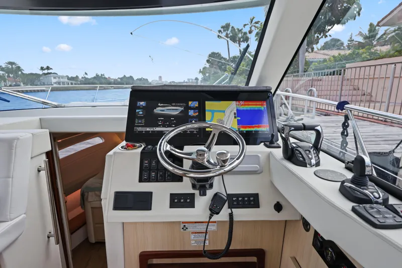  Yacht Photos Pics 2024 Regal 38 XO yacht helm with advanced navigation and control systems.