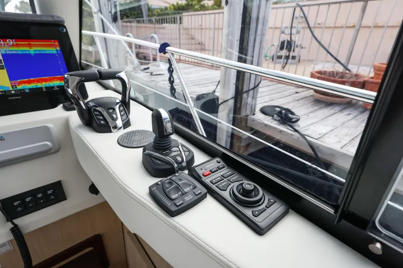  Yacht Photos Pics 2024 Regal 38 XO helm controls with advanced navigation technology.