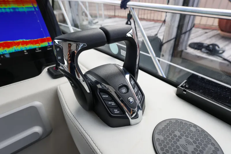  Yacht Photos Pics 2024 Regal 38 XO boat throttle control with digital display and sleek design.