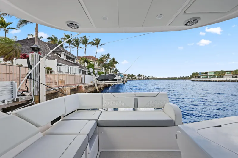  Yacht Photos Pics Luxurious 2024 Regal 38 XO yacht interior with waterfront view and modern seating.