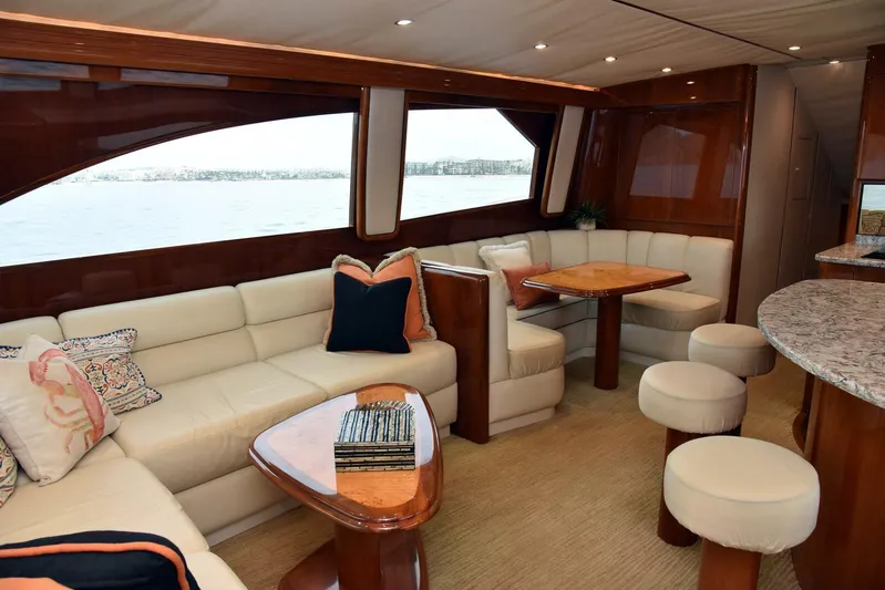 Crank It Up Yacht Photos Pics Luxurious interior of a 2014 Viking 62 Convertible yacht with plush seating and wooden accents.