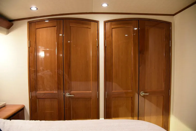 Crank It Up Yacht Photos Pics Luxurious wooden interior doors on a 2014 Viking 62 Convertible yacht.