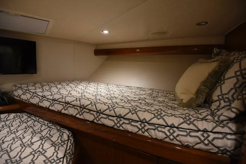 Crank It Up Yacht Photos Pics 2014 Viking 62 Convertible yacht cabin with twin beds and TV.
