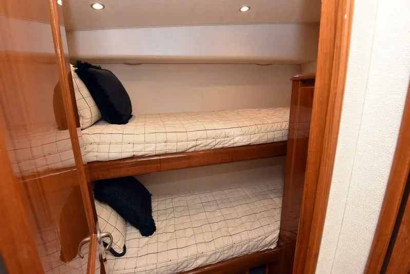 Crank It Up Yacht Photos Pics Bunk beds in 2014 Viking 62 Convertible yacht cabin with wooden finishes.