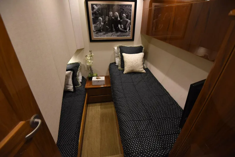 Crank It Up Yacht Photos Pics 2014 Viking 62 Convertible cabin with twin beds and modern decor.