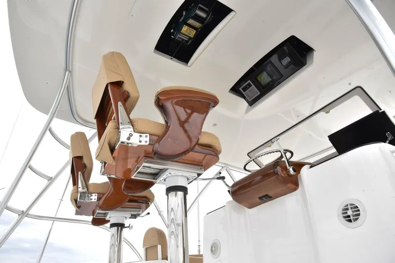 Crank It Up Yacht Photos Pics Luxurious helm chairs on the 2014 Viking 62 Convertible yacht.