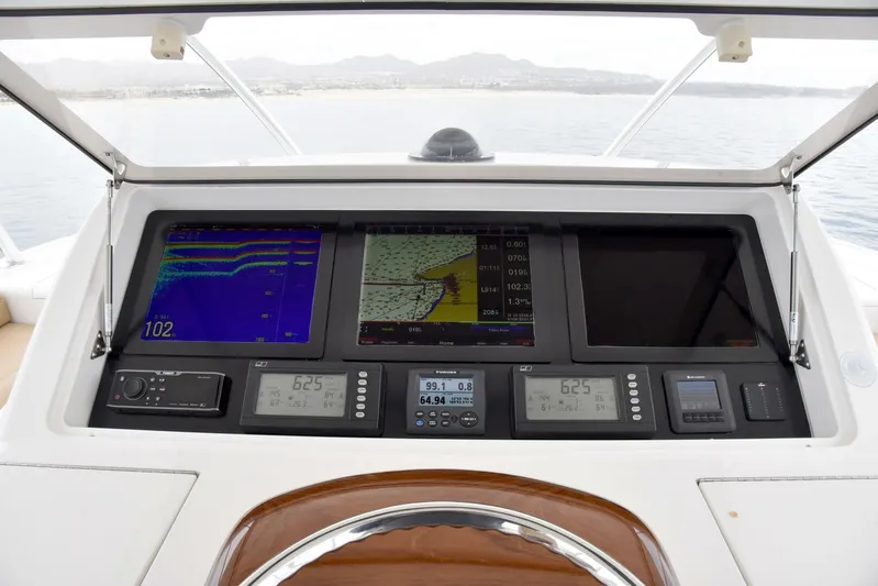 Crank It Up Yacht Photos Pics 2014 Viking 62 Convertible yacht dashboard with navigation and control systems.