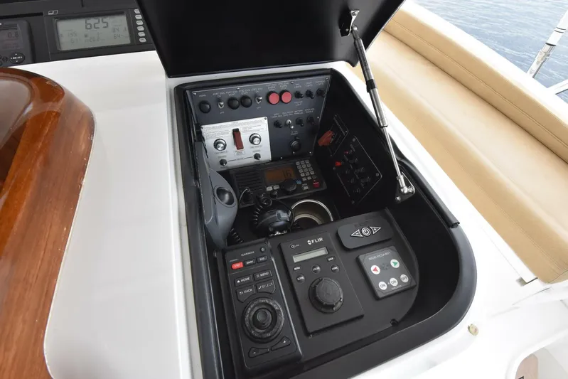 Crank It Up Yacht Photos Pics Control panel of a 2014 Viking 62 Convertible yacht with navigation and communication equipment.