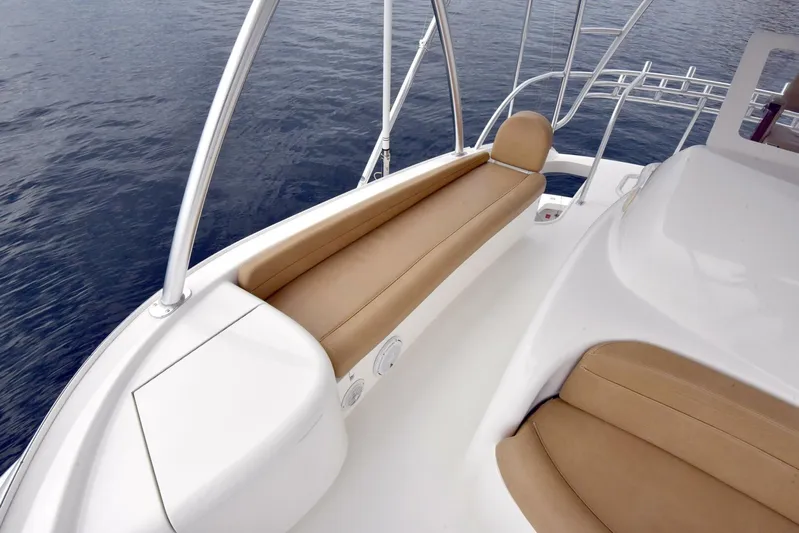 Crank It Up Yacht Photos Pics 2014 Viking 62 Convertible boat with tan seating and white deck.