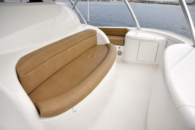 Crank It Up Yacht Photos Pics 2014 Viking 62 Convertible boat with tan leather seating on deck.