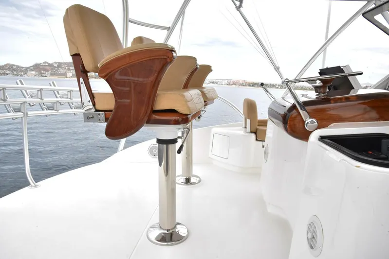 Crank It Up Yacht Photos Pics Captain's chairs on the deck of a 2014 Viking 62 Convertible yacht.