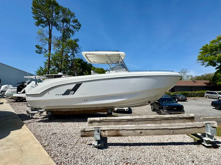  Yacht Photos Pics 2024 Beneteau Flyer 9 SPACEdeck boat on display outdoors, side view.