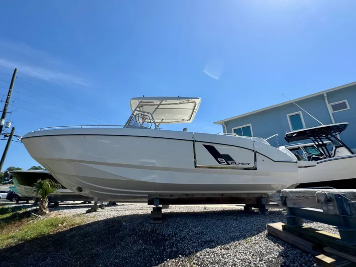  Yacht Photos Pics 2024 Beneteau Flyer 9 SPACEdeck boat displayed outdoors on a sunny day.