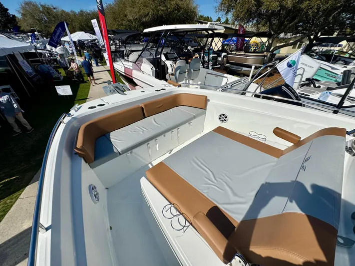  Yacht Photos Pics 2024 Beneteau Flyer 9 SPACEdeck boat with spacious seating and modern design at a boat show.