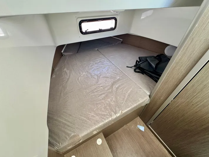  Yacht Photos Pics 2024 Beneteau Flyer 9 SPACEdeck cabin interior with bed and window view.