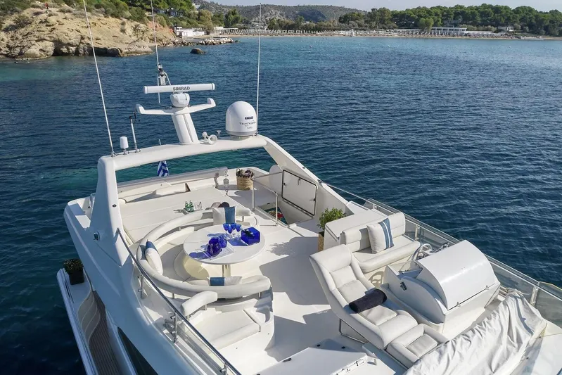 Miren Yacht Photos Pics Luxurious 2000 Ferretti Yachts 68 with spacious deck, cruising in serene coastal waters.