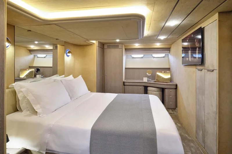 Miren Yacht Photos Pics Luxurious bedroom interior of 2000 Ferretti Yachts 68, featuring elegant design and modern amenities.